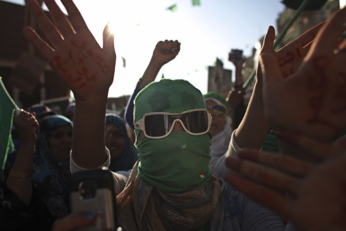 Women take part in a rally in the town of Zlitan, roughly 160 kilometers east of Tripoli, Libya, in this file photo taken on July 15, 2011. Libyan leader Moammar Gadhafi has rejected the decision by the U.S. and other countries to recognize the rebels fighting to oust him, and he vows never to surrender.  AP