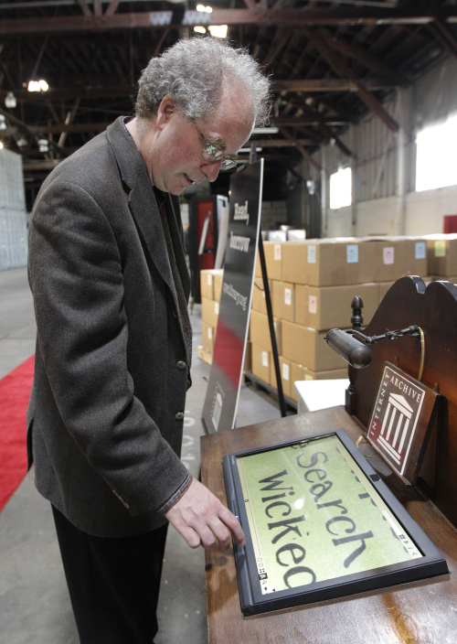 <YONHAP PHOTO-2031> In this July 21, 2011 photo, Brewster Kahle, digital librarian for the Internet Archive, demonstrates the zoom function while scanning a book on a touch screen at the Internet Archive's Physical Archive warehouse in Richmond, Calif. Saving a copy of every Web page ever posted sounds like an ambitious life's work, but Khale has decided digital isn't enough. The founder of the Internet Archive wants to expand his effort to provide "universal access to all knowledge" by preserving a physical copy of every book ever written. (AP Photo/Jeff Chiu)/2011-07-31 23:23:05/ <저작권자 ⓒ 1980-2011 ㈜연합뉴스. 무단 전재 재배포 금지.>\r\nBrewster Kahle, digital librarian for the Internet Archive, demonstrates the zoom function while scanning a book on a touch screen at the Internet Archive’s Physical Archive warehouse in Richmond on July 21.  AP-Yonhap News
