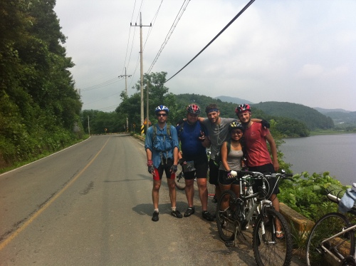 James Foster (right) and Cristina Yim (second from right) stop for a picture with friends during their charity bikeathon Wednesday.