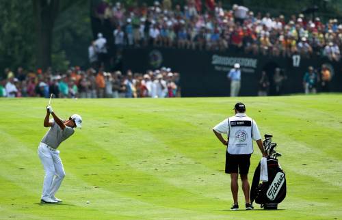 <YONHAP PHOTO-0172> AKRON, OH - AUGUST 06: Adam Scott of Australia hits an approach shot on the 17th hole as caddie Steve Williams looks on during the third round of the World Golf Championships-Bridgestone Invitational on the South Course at Firestone Country Club on August 6, 2011 in Akron, Ohio. Andy Lyons/Getty Images/AFP== FOR NEWSPAPERS, INTERNET, TELCOS & TELEVISION USE ONLY == /2011-08-07 05:59:30/ <저작권자 ⓒ 1980-2011 ㈜연합뉴스. 무단 전재 재배포 금지.>\r\nAdam Scott hits an approach shot on the 17th hole during the third round of the Bridgestone Invitational golf tournament at Firestone Country Club in Akron, Ohio, Saturday.  AFP-Yonhap News\r\nAdam Scott hits an approach shot on the 17th hole during the third round of the Bridgestone Invitational golf tournament at Firestone Country Club in Akron, Ohio, Saturday.  AFP-Yonhap News