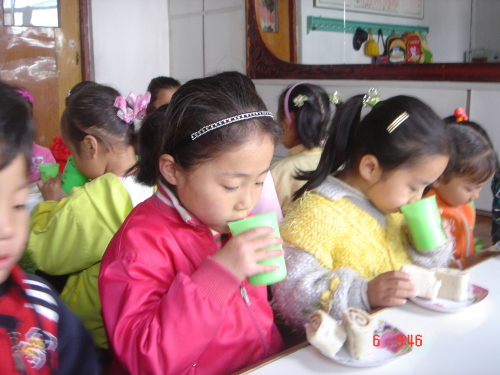 Sharing page pics Aug 18\r\nChildren enjoy bread baked at one of LINK’s existing bakeries in North Korea   LINK