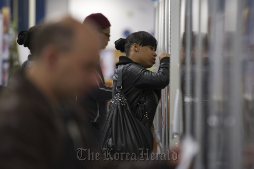 Job seekers look at listings on a bulletin board at the One Stop Career Link Center in San Francisco, California.  Bloomberg