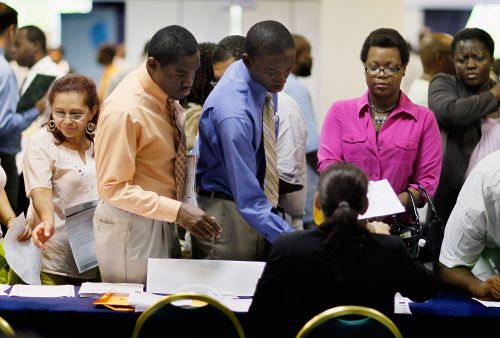 <YONHAP PHOTO-0590> MIAMI, FL - AUGUST 23: People look for work at a recruiters desk setup at a job fair in the James L. Knight Center on August 23, 2011 in Miami, Florida. The job fair, known as "For the People" Jobs Initiative, was organized by the Congressional Black Caucus and is part of a nationwide series of job fairs and town hall meetings. Joe Raedle/Getty Images/AFP== FOR NEWSPAPERS, INTERNET, TELCOS & TELEVISION USE ONLY == /2011-08-24 07:14:38/ <저작권자 ⓒ 1980-2011 ㈜연합뉴스. 무단 전재 재배포 금지.>\r\nPeople look for work at a recruiter’s desk setup at a job fair in the James L. Knight Center in Miami.  AFP-Yonhap News