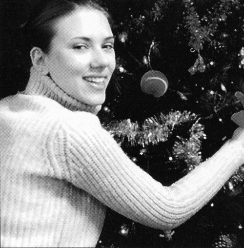 In this 2002 image released by Ancestry.com, actress Scarlett Johansson is shown decorating a Christmas tree during her senior year at Professional Childrens School in New York. (AP)