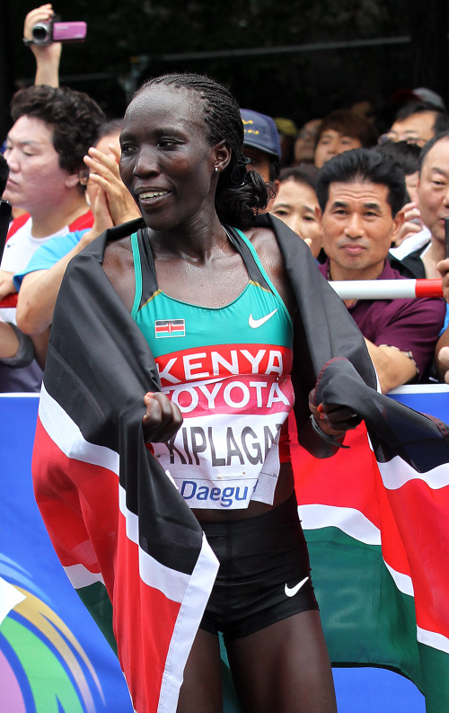 Edna Kiplagat express her joy after winning the gold medal for women's marathon at the World Championships in Athletics in Daegu on Saturday.