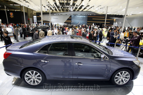 A Chevrolet Malibu vehicle sits on display at the Auto Shanghai 2011 car show in Shanghai.  Bloomberg
