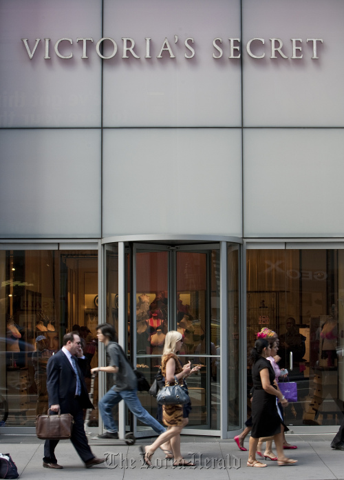 Pedestrians walk past a Victoria’s Secret store in New York.\n Bloomberg