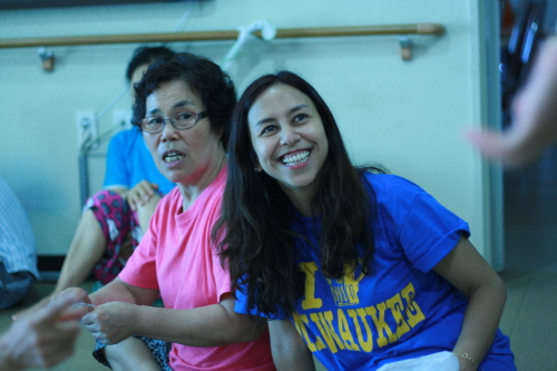 Kiki Fastino laughs along with an Angel House resident. (Kirsty Taylor/The Korea Herald)