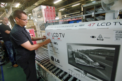 Workers at LG Electronics Wroclaw work at the television production line of the factory in southwestern Poland last week.  LG Electronics