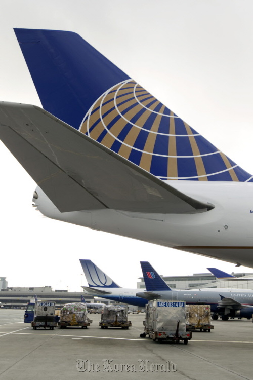 United Continental Holdings Inc. jets sit on the tarmac at San Francisco International Airport in California.  Bloomberg