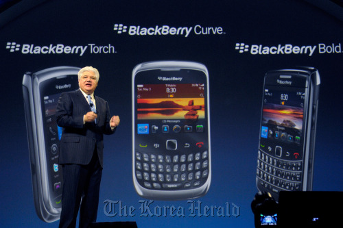 Mike Lazaridis, president, co-chief executive officer and co-founder of Research In Motion Ltd., addresses the audience at the BlackBerry World conference in Orlando, Florida.  Bloomberg