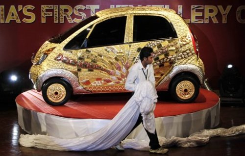 The Tata Motors 'Nano' car crafted in gold, silver and gem stones during its unveiling in Mumbai, India, Monday. (AP)
