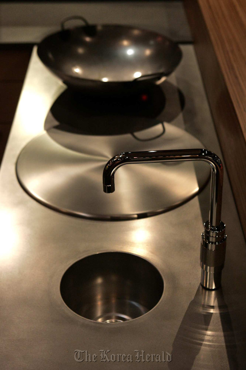 Stainless steel is one alternative to the ever-present granite countertop in a modern kitchen. \n    Los Angeles Times/MCT