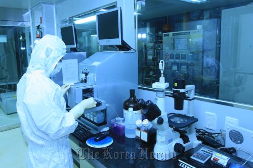 A Medipost researcher works to develop stem cell medicine.    Medipost