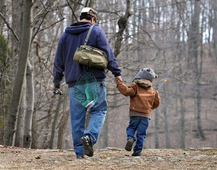 A father and son head for their fishing hole at Muddy Run Recreation Park in southern Lancaster County, Pennsylvania New research suggests that dads are less likely to die of heart-related problems than childless men are.   (AP)