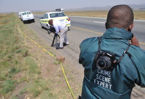 In this photo taken Sept. 28, 2011, the crime scene where Mark Andrews was found shot dead is cordoned off by police investigating the murder, near Johannesburg. (AP)