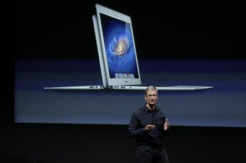 Apple CEO Tim Cook gestures during the announcement at Apple headquarters in Cupertino, Calif., Tuesday. (AP)