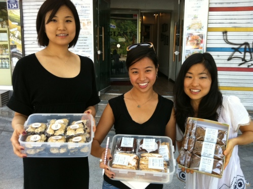 Charity bakers hold their vegan goodies outside Suji’s restaurant in Itaewon, Seoul.  Daniel Gray