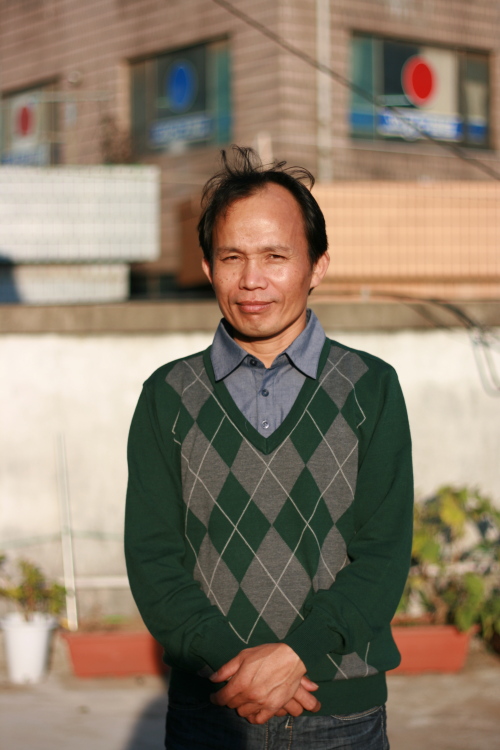 Ronel Chakma Nani, one of the first Jumma people to arrive in Korea, stands outside the new Jum library in Yangchon, Gyeonggi Province.