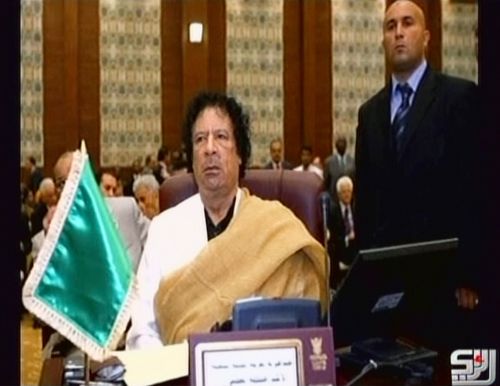 <YONHAP PHOTO-0624> EDITOR'S NOTE: RESTRICTED TO EDITORIAL USE - MANDATORY CREDIT "AFP PHOTO / HO / ARRAI TELEVISION" - NO MARKETING NO ADVERTISING CAMPAIGNS - DISTRIBUTED AS A SERVICE TO CLIENTS -- An image grab taken from the Syrian-based Arrai television shows a file picture of former Libyan leader Moamer Kadhafi as he allegedly gives an audio message from an undisclosed location on October 4, 2011. The deposed strongman called on Libyans to turn out in their millions to demonstrate against the country's new rulers, in an audio message broadcast on Syria-based Arrai television. AFP PHOTO/HO/ARRAI TELEVISION /2011-10-07 05:47:04/ <저작권자 ⓒ 1980-2011 ㈜연합뉴스. 무단 전재 재배포 금지.>\r\nAn image grab taken from the Syrian-based Arrai television shows a picture of former Libyan leader Moammar Gadhafi as he gives an audio message from an undisclosed location. AFP-Yonhap News