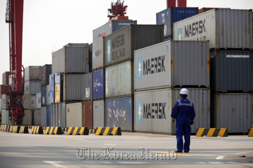 Containers are stacked at the Yangshan Deep Water Port in Shanghai.  Bloomberg