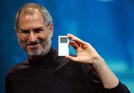Apple CEO Steve Jobs displays the iPod mini at the Macworld Conference and Expo in San Francisco in 2004. Jobs died of pancreatic\r\ncancer at 56. (AP)