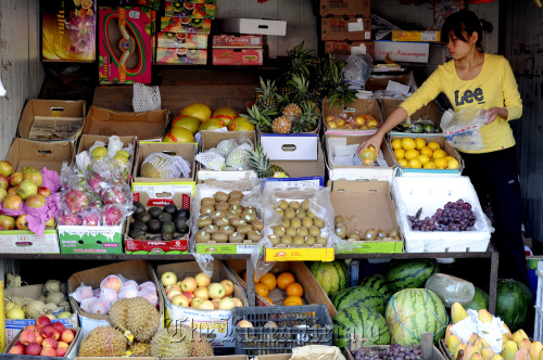 Produce is displayed for sale at a market in Beijing.  Bloomberg