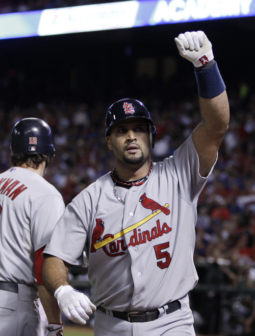 <YONHAP PHOTO-0639> St. Louis Cardinals' Albert Pujols reacts after hitting a three-run home run during the sixth inning of Game 3 of baseball's World Series against the Texas Rangers Saturday, Oct. 22, 2011, in Arlington, Texas. (AP Photo/Matt Slocum)/2011-10-23 11:53:56/ <저작권자 ⓒ 1980-2011 ㈜연합뉴스. 무단 전재 재배포 금지.>
St. Louis Cardinals first baseman Albert Pujols reacts after hitting a three-run home run in the sixth inning.
AP-Yonhap News