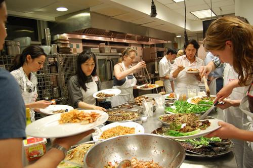 Participants of “The Korean Plate” enjoy a spread of Korean dishes.    Yonhap News