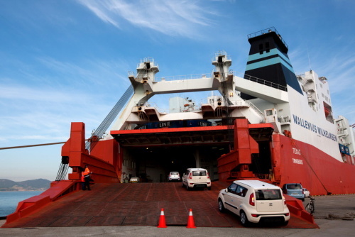 Kia Motors Corp. vehicles bound for export are driven into a car carrier ship at the port in Mokpo. (Bloomberg)