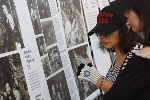 People learn about North Korean issues during a PSCORE campaign at the Busan International Film Festival in October.   PSCORE