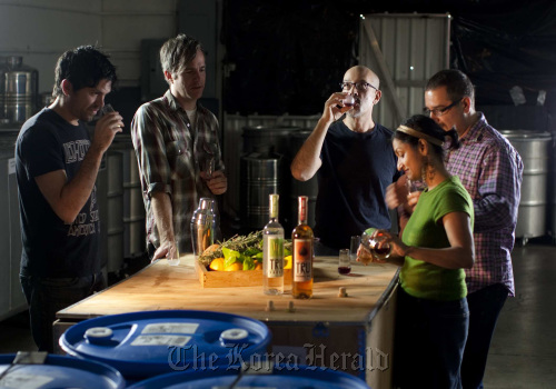 From left: Taste testers Anthony Pecos, general manager of Mohawk Bend, Keith Taylor of Mohawk Bend, Louis Anderman, of Miracle Miles Bitters Co., Melkon Khosrovian, co-founder an spirits maker at Modern Spirits and Litty Mathew, co-founder and spirits maker at Modern Spirits, sip TRU Organic gin and FRUITLAB Hibiscus Liqueur at Modern Spirits distillery in Monrovia, California.
Los Angeles Times/MCT