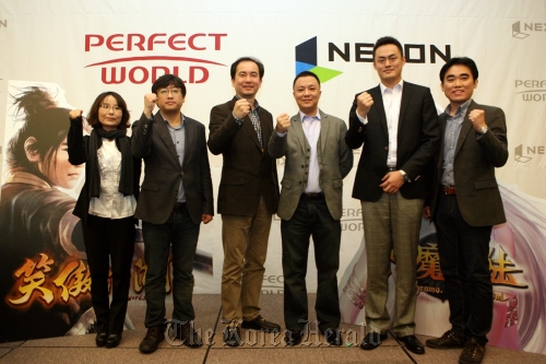 Executives from NEXON and Perfect World Co. pose after announcing a plan to set up a joint venture on Thursday.      NEXON