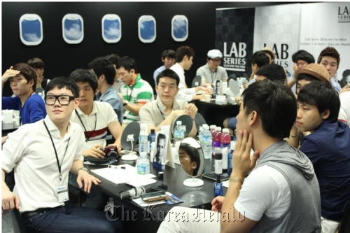 Participants attend a grooming class offered by men’s skincare brand Lab Series.  Lab Series