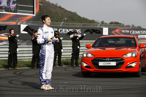 Olympic figure skating gold medalist Kim Yu-na introduces the New Genesis Coupe of Hyundai Motor at the launch of the sports sedan in Yeongam, South Jeolla Province, on Saturday.  Hyundai Motor
Olympic figure skating gold medalist Kim Yu-na introduces the New Genesis Coupe of Hyundai Motor at the launch of the sports sedan in Yeongam, South Jeolla Province, on Saturday.  Hyundai Motor