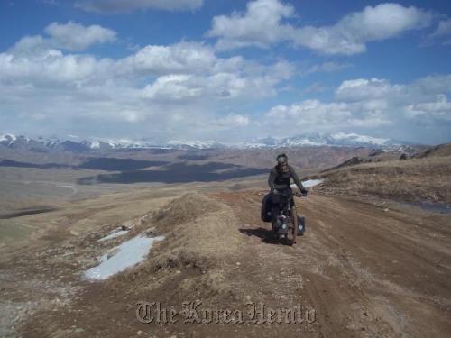 Tom McConville cycles through Kyrgystan, about halfway along his journey from Korea to the U.K.      Tom McConville