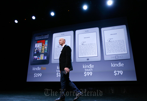 Jeff Bezos, chief executive officer of Amazon.com Inc., introduces the new Kindle Fire tablet computer at a news conference in New York.   Bloomberg