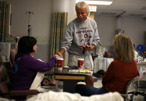 Dan Dewey (center) of Dan's Coffee Run, hands out coffee to Mechelle Burdette (left) cancer patient from East Pointe and her aunt Sharon Ralston, of Palmcoast, Florida, while at the Michigan Cancer Institute in St. Joseph Mercy Oakland Hospital in Pontiac, Michigan, Nov. 3. (Andre J. Jackson/Detroit Free Press/MCT)