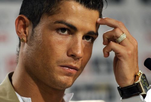 A file photo taken on July 6, 2009 shows Real Madrid's Portuguese player Cristiano Ronaldo gesturing while giving a press conference after his official presentation at the Santiago Bernabeu stadium in Madrid. (AFP)
