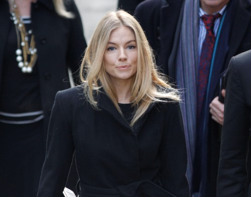 British actress Sienna Miller arrives at the Leveson Inquiry into media practices at the High Court in central London on Thursday. (AP)