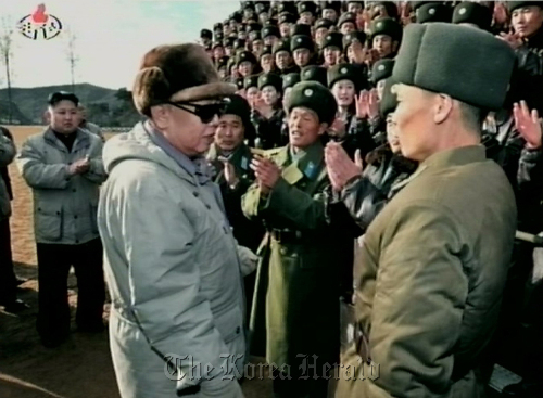 A photo released last Saturday by the North’s Korean Central Television shows the communist state’s leader Kim Jong-il and his third son and heir apparent Kim Jong-un visiting an Air Force unit in a recent series of events to inspect the military.   Yonhap News