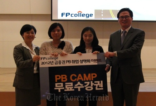 Workers at education institution FP College promote their finance camp for students wanting to become private bankers.   FP College