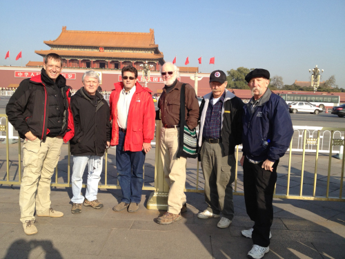 American volunteers (from left) Rob Beckham, Frank Purvis, Dave West, Earl Martin, Charlie Thell and Tim DuBois stand in front of Beijing’s Forbidden City while waiting in China for their visas to be approved before arriving in North Korea on Dec. 6.    (FCH)