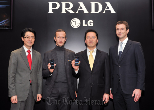 Executives of LG Electronics and PRADA Group pose with Prada Phone 3.0 at a launch event in London on Wednesday. LG Electronics