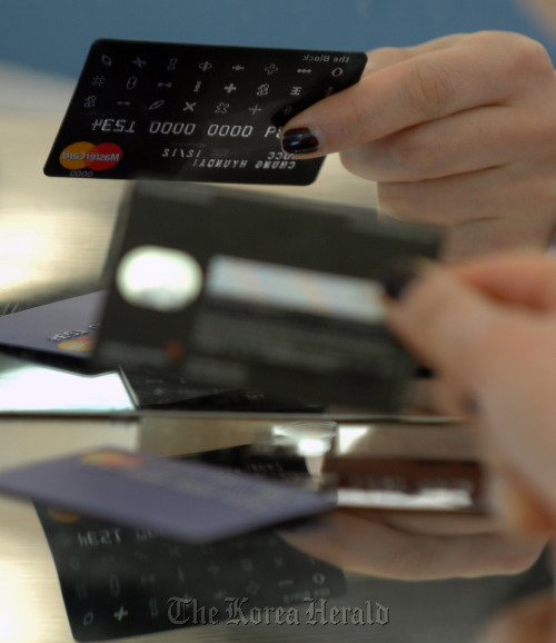 A Hyundai Card Co. credit card is displayed for a photograph at the company’s headquarters in Seoul.   Bloomberg
