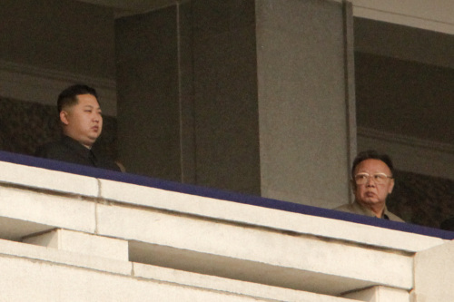 Kim Jong Il, leader of North Korea, left, looks towards his son Kim Jong Un, during a military parade commemorating the 65th anniversary of founding of the Workers' Party of Korea in Pyongyang, North Korea, on Sunday, Oct. 10, 2010. (Bloomberg(
