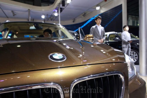 A Bayerische Motoren Werke AG vehicle stands on display during the media preview of the Guangzhou International Automobile Exhibition in Guangzhou, Guangdong Province, China.  Bloomberg