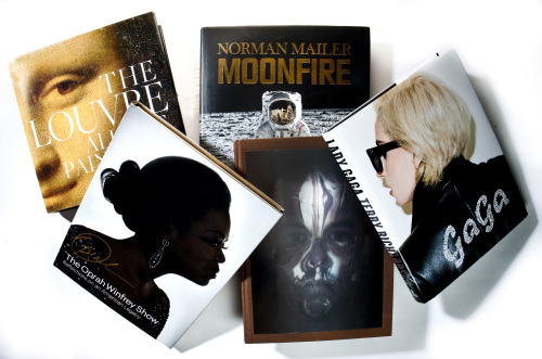 “Savage Beauty,” by Alexander McQueen, “The Oprah Winfrey Show, Reflections on an American Legacy,” “The Louvre, All the Paintings,” by Erich Lessing and Vincent Pomarede, “MoonFire,” by Norman Mailer, and “GaGa,” by Tony Richardson. (Bill Hogan/Chicago Tribune/MCT)