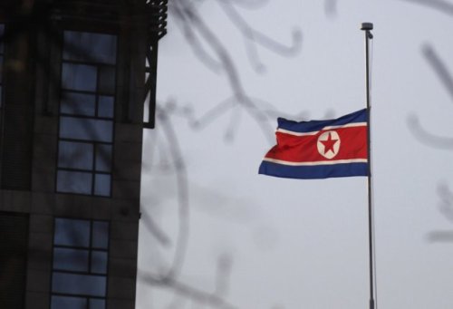 North Korea's flag is flown at half-mast at the North Korean Embassy to mourn the death of North Korean leader Kim Jong Il in Beijing, China, Friday. (AP-Yonhap)