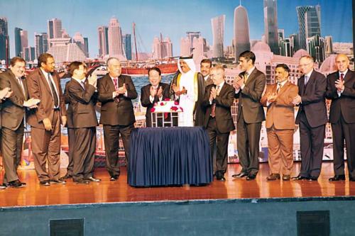 Qatar’s Ambassador to Korea Ali Hamad Mubarak Al Marri (sixth
from right) applauds with other diplomats at the Qatar National
Day in Seoul on Monday. (Qatari Embassy)